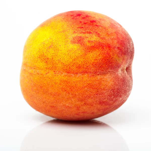 Один персик — стокове фото