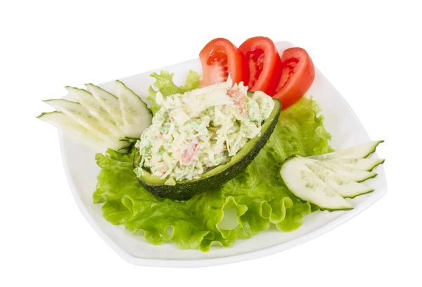 Крабовый салат с зеленой икрой в авокадо - японская кузина — стоковое фото