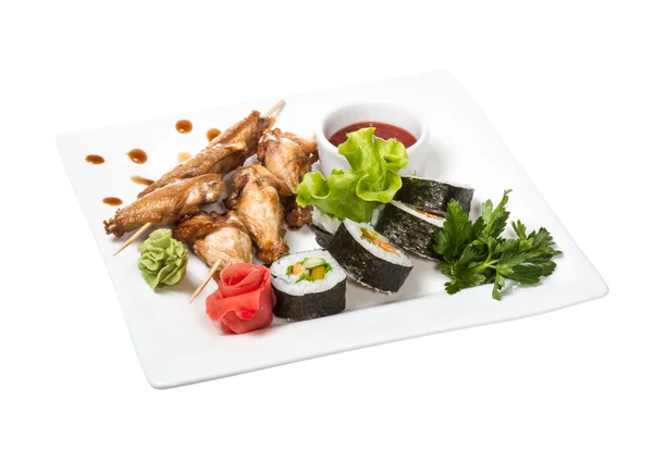 stock image Buffalo chicken wings on plate with sushi