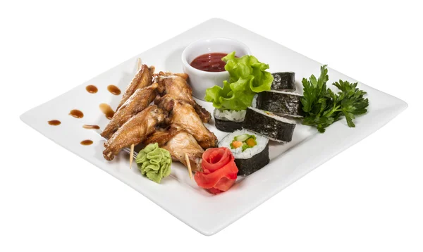 Stock image Buffalo chicken wings on plate with sushi