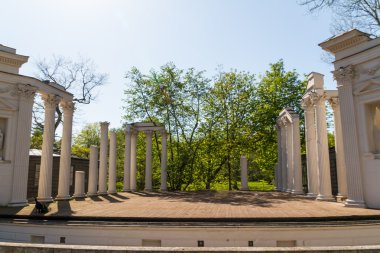 Lazienki Park with Roman inspired theater and Palace on the Wate clipart