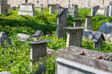 The Remuh Cemetery in Krakow, Poland, is a Jewish cemetery estab clipart