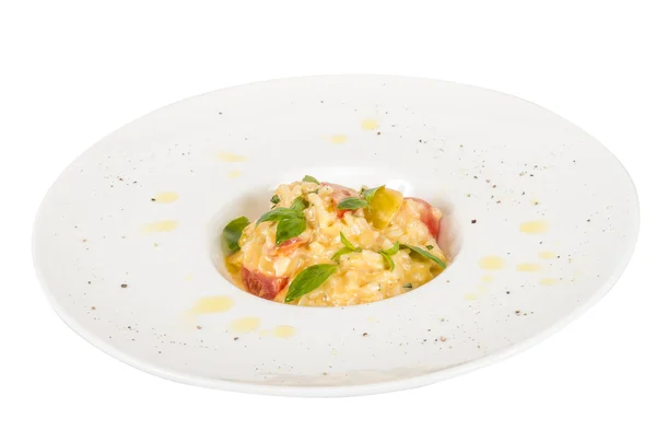 Foto av läcker risotto maträtt med örter och tomat på vita b — Stockfoto