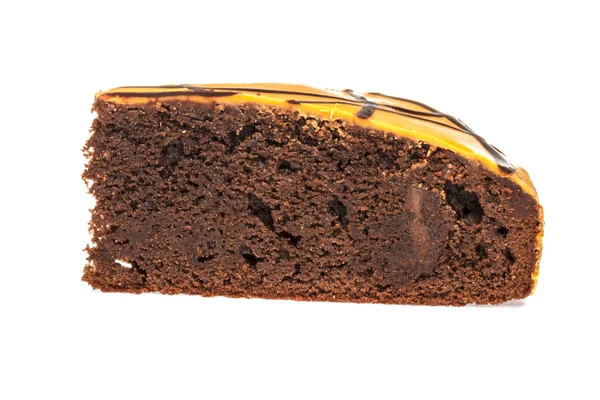 Piece of chocolate cake with icing on white isolated background — Stock Photo, Image