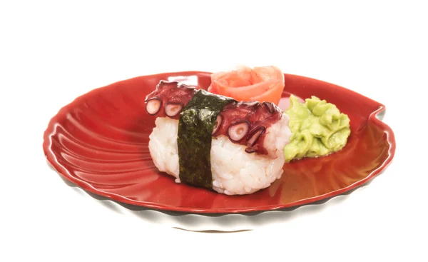 Японские суши с мясным осьминогом на белом фоне — стоковое фото