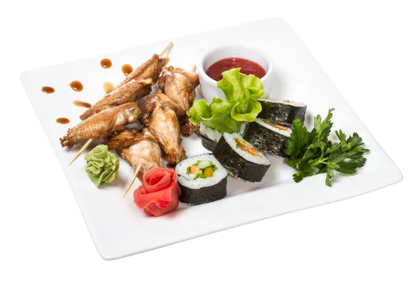 stock image Buffalo chicken wings on plate with sushi