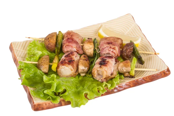 Bacon wrapped grilled Scallops with mushrooms and bacon Royalty Free Stock Images