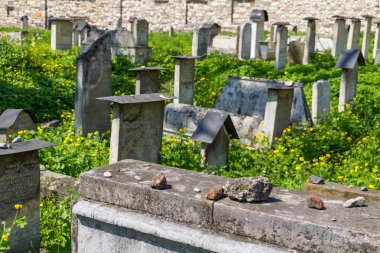 The Remuh Cemetery in Krakow, Poland, is a Jewish cemetery established in 1535. It is located beside the Remuh Synagogue clipart