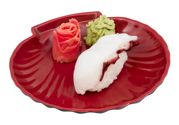 Японський суші з м'ясо восьминога на білому фоні — стокове фото