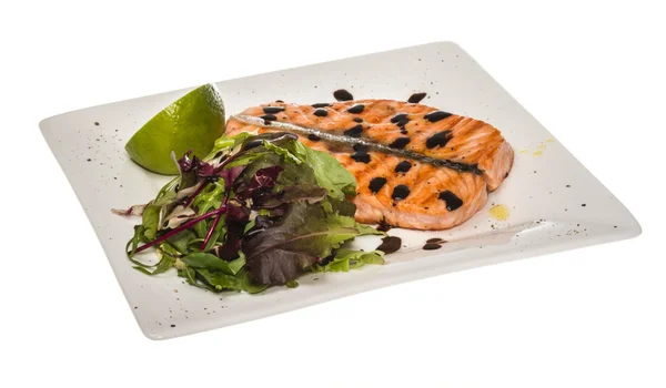 stock image Savory fish portion : roasted norwegian salmon fillet garnished