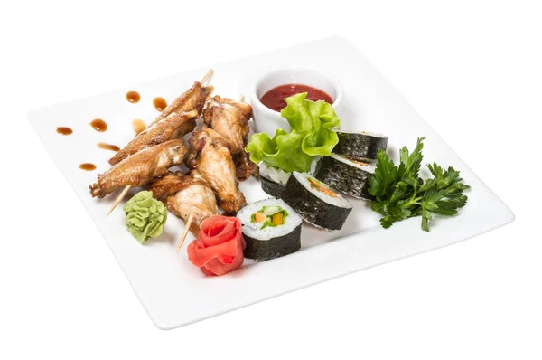 stock image Buffalo chicken wings on plate with sushi