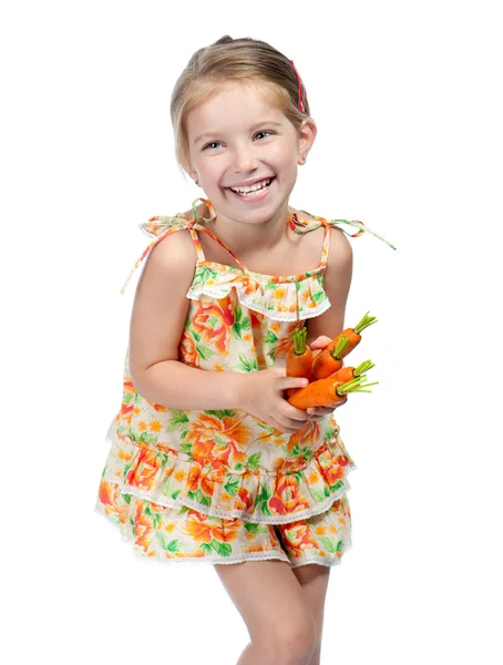 Маленька дівчинка з морквою — стокове фото