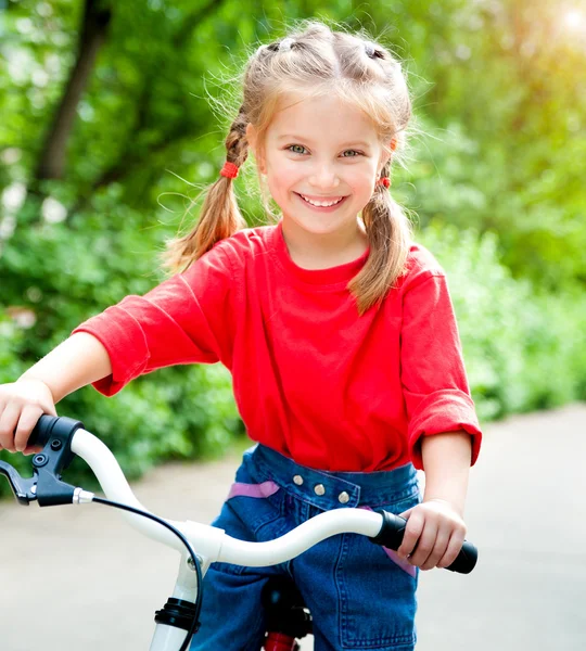 Girl with bicycle — Stock Photo, Image