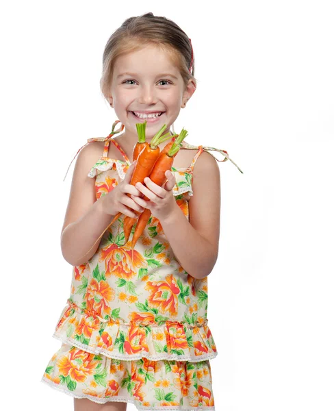 Маленька дівчинка з морквою — стокове фото