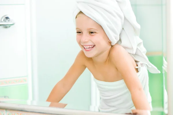 Cute little girl in the mirror — Stock Photo, Image