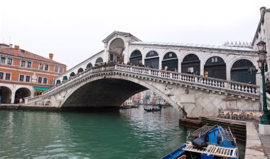 Venice Grand canal with gondolas and Rialto Bridge clipart