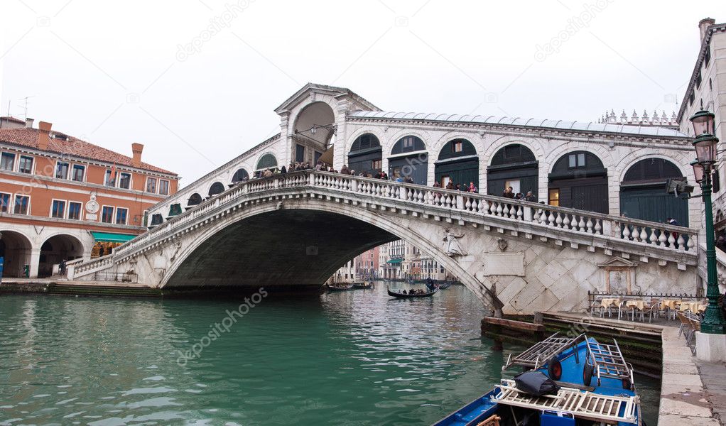 Venice Grand canal with gondolas and Rialto Bridge