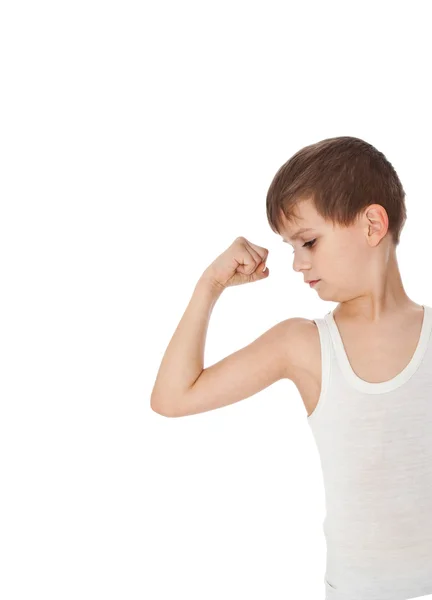Chlapec ukazuje jeho svalů — Stock fotografie
