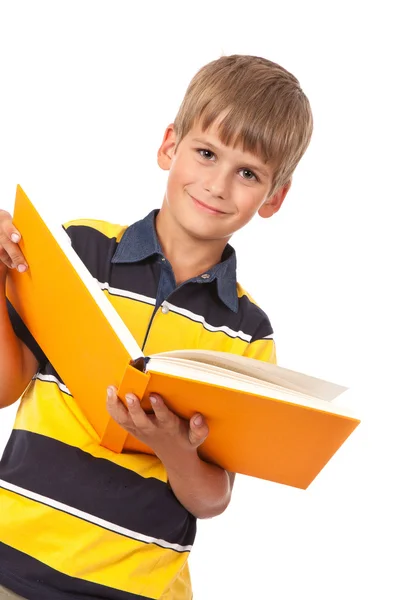 学校的男孩拿一本书 — 图库照片