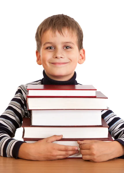男子生徒と白い背景で隔離の書籍のヒープ — ストック写真