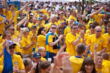 KYIV, UKRAINE - JUNE 15: Sweden and Ukrainian fans arrive in the clipart