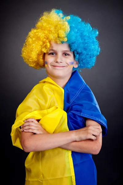 Football fan with ukrainian flag on a black background — Stock Photo, Image