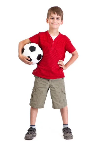 Netter Junge hält einen Fußballball in der Hand. Fußball Stockbild