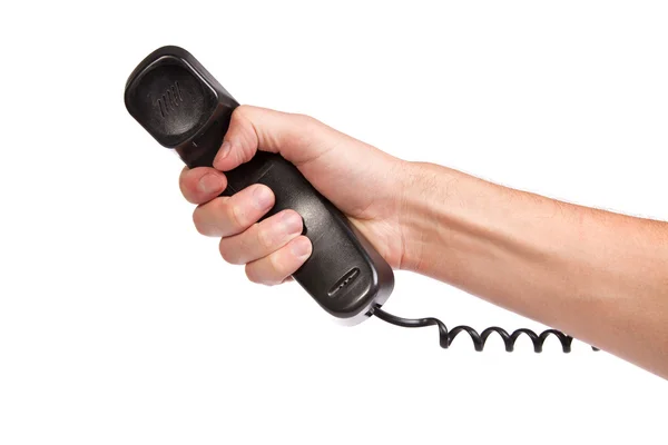 Hand hält einen alten schwarzen Telefonschlauch — Stockfoto