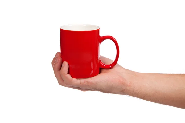 Mão masculina está segurando um copo vermelho — Fotografia de Stock