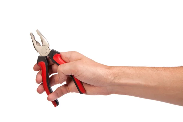Mężczyzna ręka trzymać szczypce czarny i czerwony — Zdjęcie stockowe
