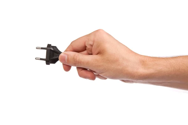 Man houdt een zwarte stopcontact in de hand — Stockfoto