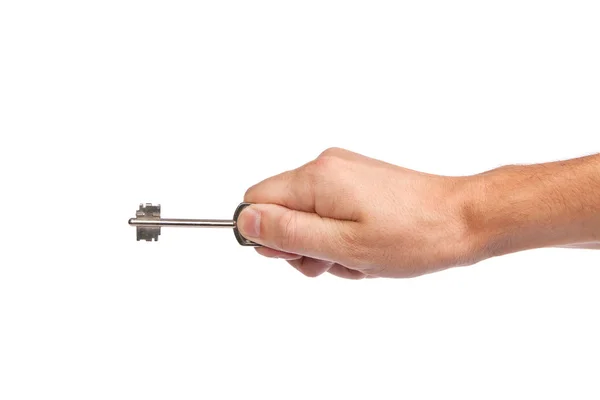 Mano masculina sosteniendo una llave de la casa — Foto de Stock