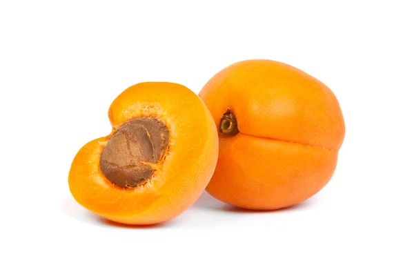 Two ripe apricot sectioned by knife — Stock Photo, Image