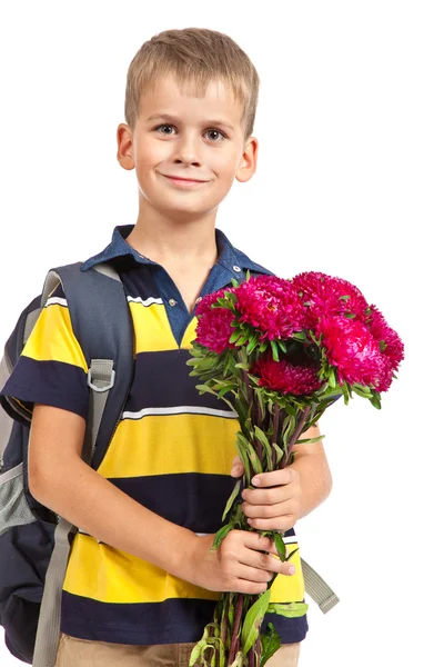 Un écolier tient des fleurs. Retour à l'école — Photo