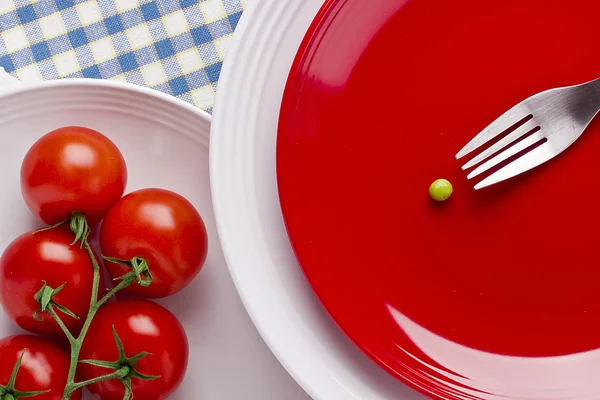 Tomates y un guisante — Foto de Stock