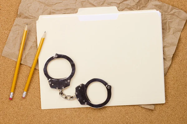 Handcuffs and Folder — Stock Photo, Image