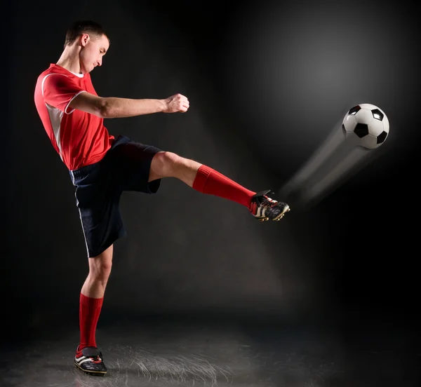 Soccer player strikes — Stock Photo, Image