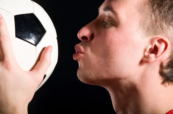 Soccer player is kissing the ball — Stock Photo, Image