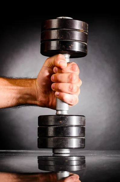 Male hand is holding metal barbell — Stock Photo, Image