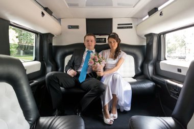 The bride and groom in limousine clipart