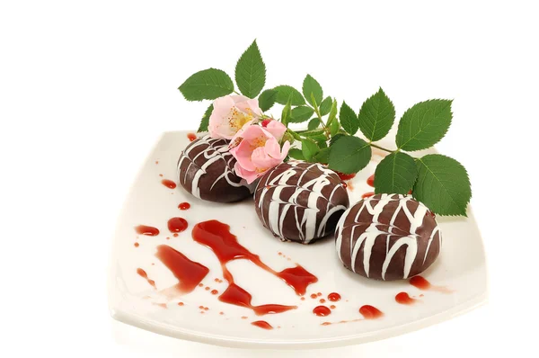 Chocolate dessert with a flower — Stock Photo, Image
