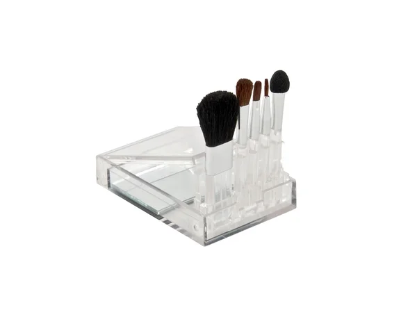 Un conjunto de pinceles para maquillaje en una caja transparente — Foto de Stock