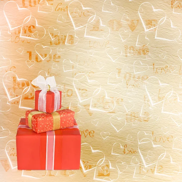 Cajas de regalo navideñas decoradas con lazos y cintas en el abstra — Foto de Stock