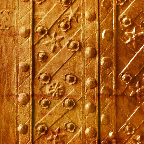 Old gold plate with a pattern of convex and star colors — Stock Photo, Image