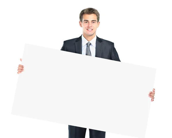 幸福微笑的年轻商业男人显示空白招牌 — 图库照片