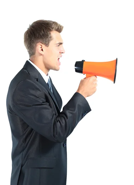 Business man screaming loudly in a megaphone — Stock Photo, Image