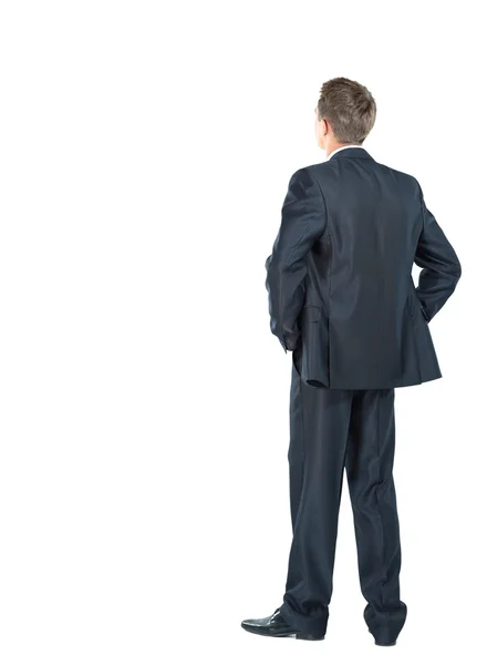 Business man from the back - looking at something over a white background — Stock Photo, Image