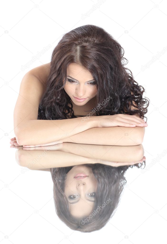 The image of a beautiful girl with a mirror