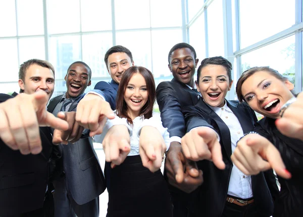 Portrait of excited young business pointing at you — Stock Photo, Image