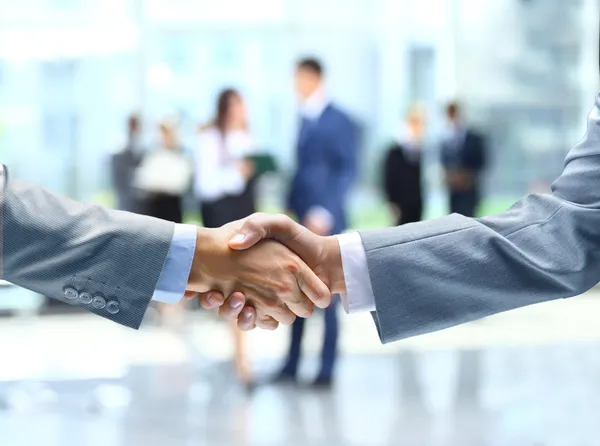 Business handshake e business Immagine Stock